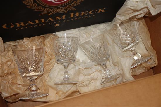 Four Stuart cut glass goblets, ten champagne and eight wine glasses